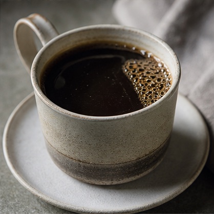 Black filter coffee in a handmade ceramic cup